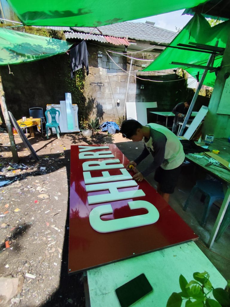 papan nama huruf akrilik di manado